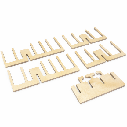 Set of five wooden comb-like tools on a white background