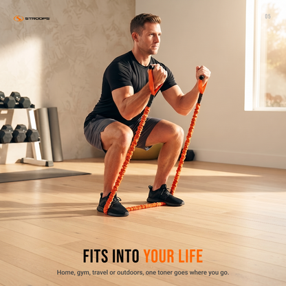 A man in a black t-shirt and gray shorts performs a squat while using an orange and black resistance band in a bright, modern home gym. The STROOPS brand logo is visible in the top left corner, and promotional text is displayed at the bottom.