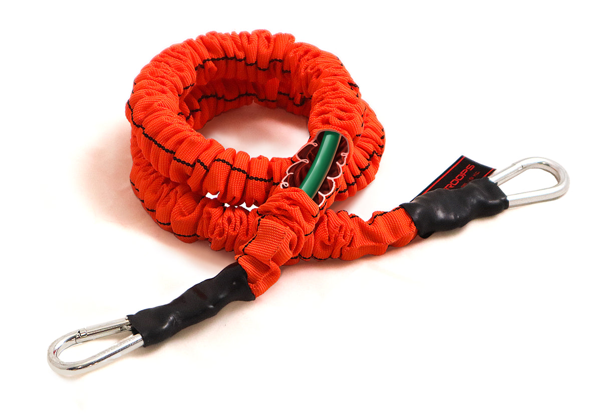 An orange elastic bungee cord with black stitched details, black wrapped handles, and silver metal carabiner clips, shown on a white background.