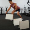 Stroops athlete setting up 12 inch hurdles