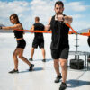 Stroops athletes doing resisted boxing group workout anchored to Revolution
