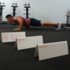 Stroops athlete doing workout with circuit written on hurdles
