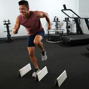 Stroops athlete doing high knees using Hurdles