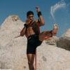Stroops athlete doing kick on beach