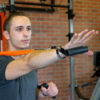 Stroops trainer Caysem doing a press with textured grip handle