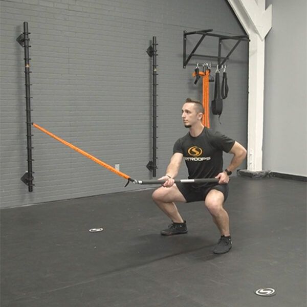 Stroops trainer Caysem doing Fit Stik Pro lateral hold squat