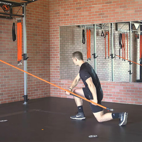 Stroops trainer Caysem doing Fit Stik Pro reverse lunge thrust
