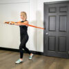 Stroops trainer Aly doing press with Sculptafit Premium resistance band kit