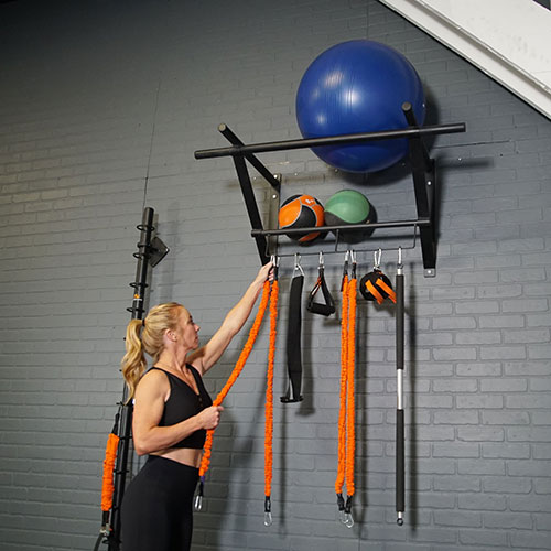 Stroops trainer Danielle setting up Equipment Storage Rack