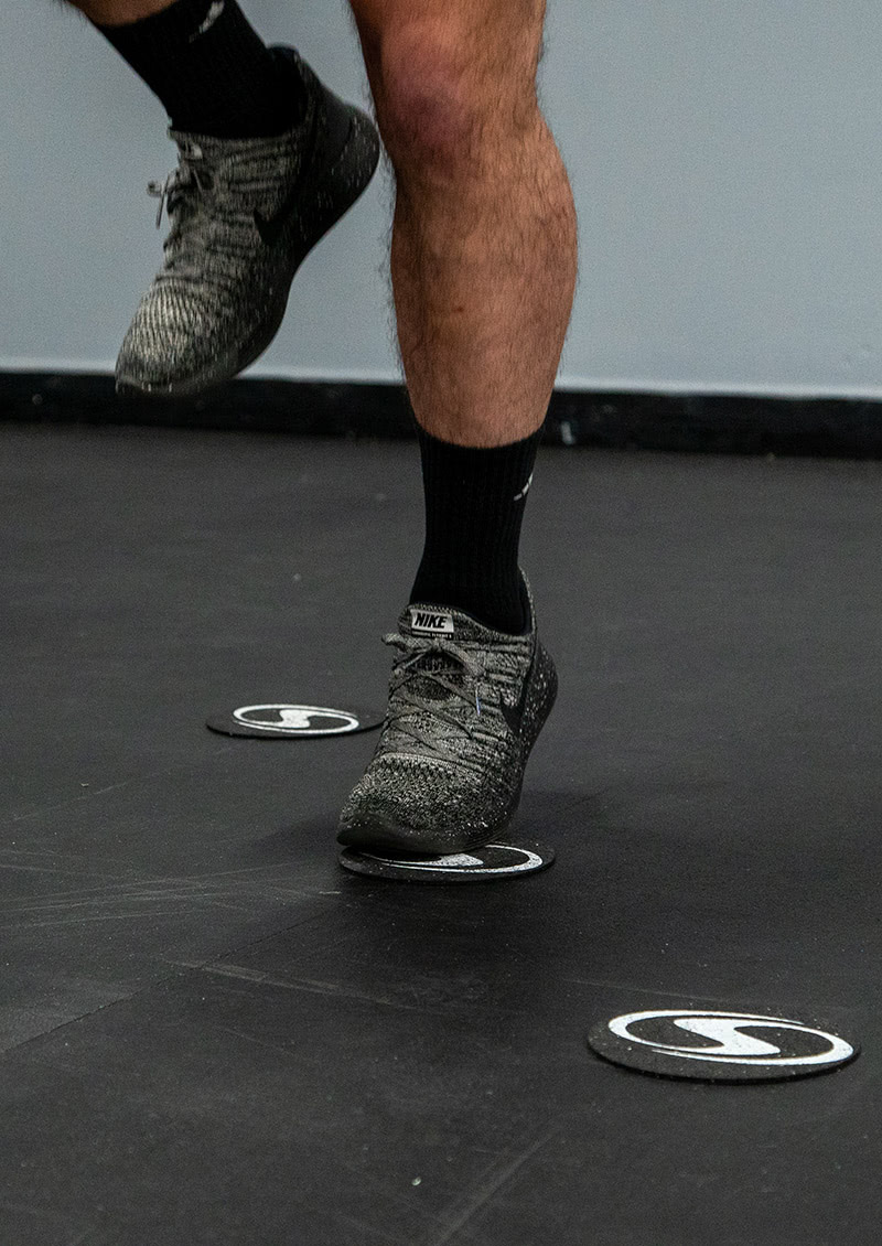 close up of agility dots being used to train