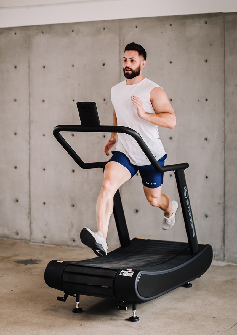 stroops athlete sprinting on the opticurve treadmill