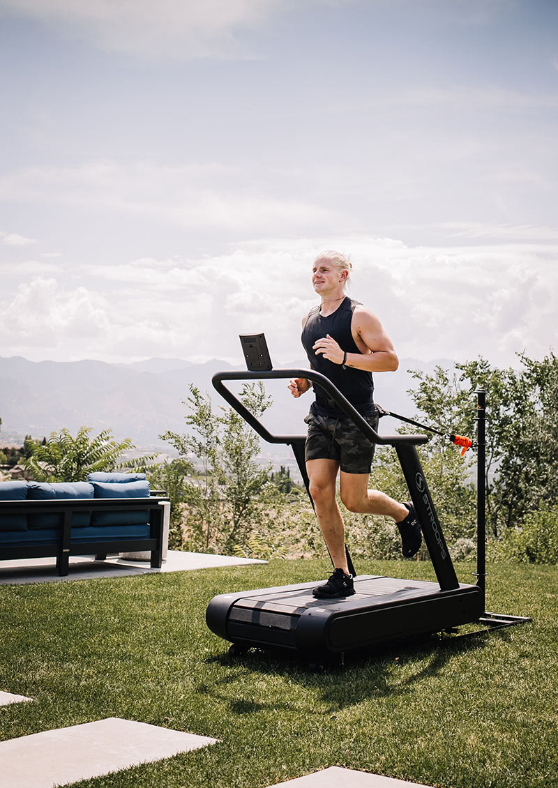 stroops athlete running on the optimill outside