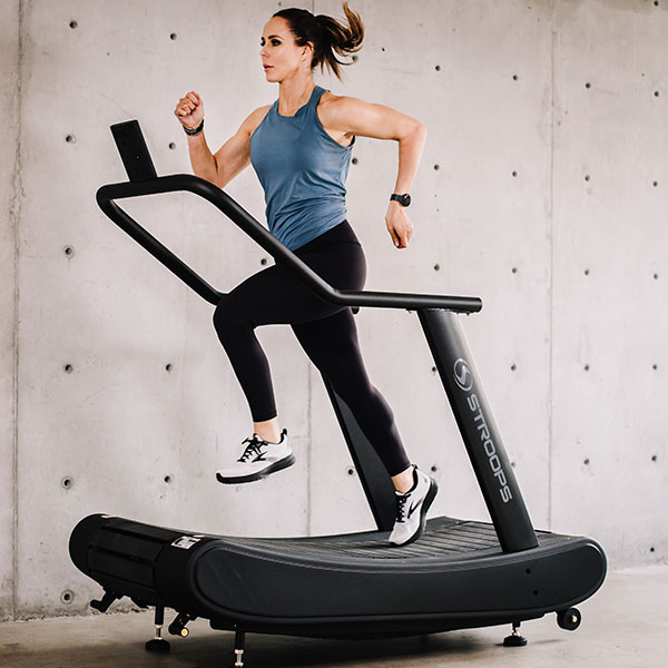 Stroops trainer Aly Purdy runs on the Opticurve curved treadmill