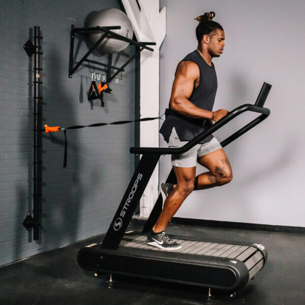 Stroops trainer Riley Burt runs on the Optimill flat motorless treadmill