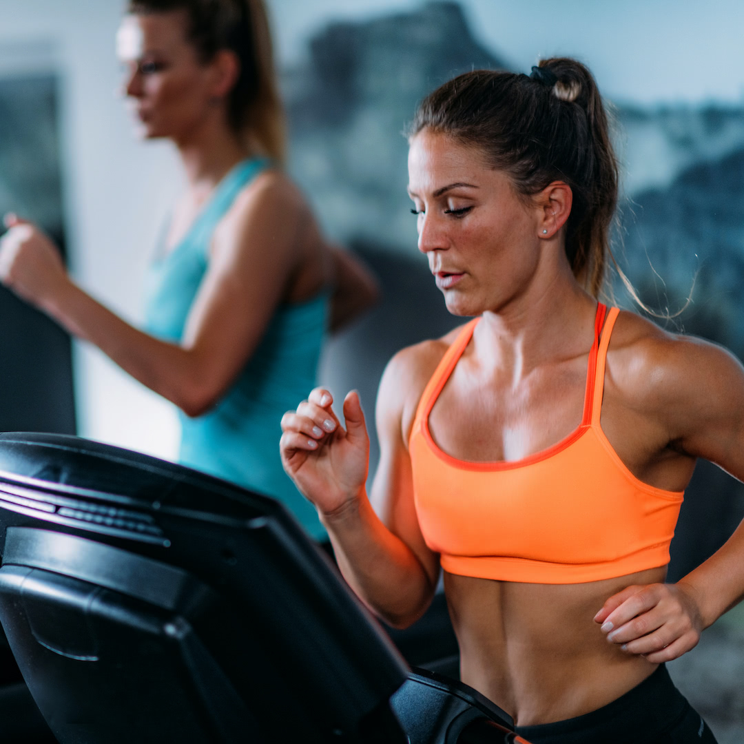 Women running on treadmills