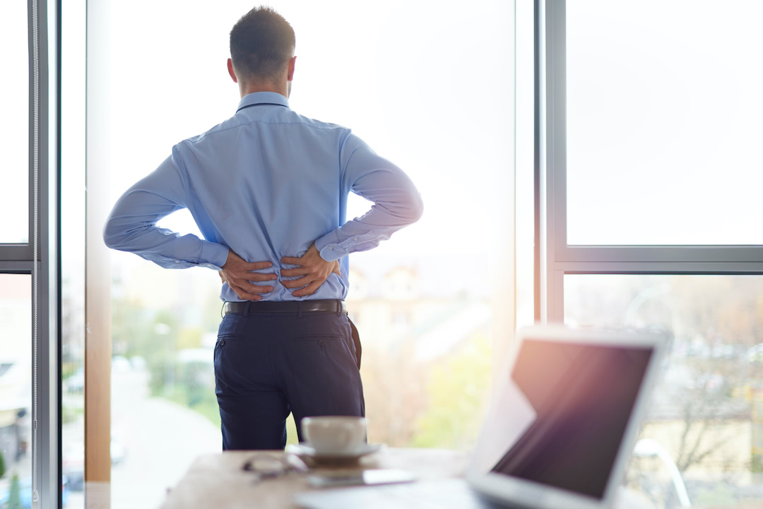 Person at office with back pain