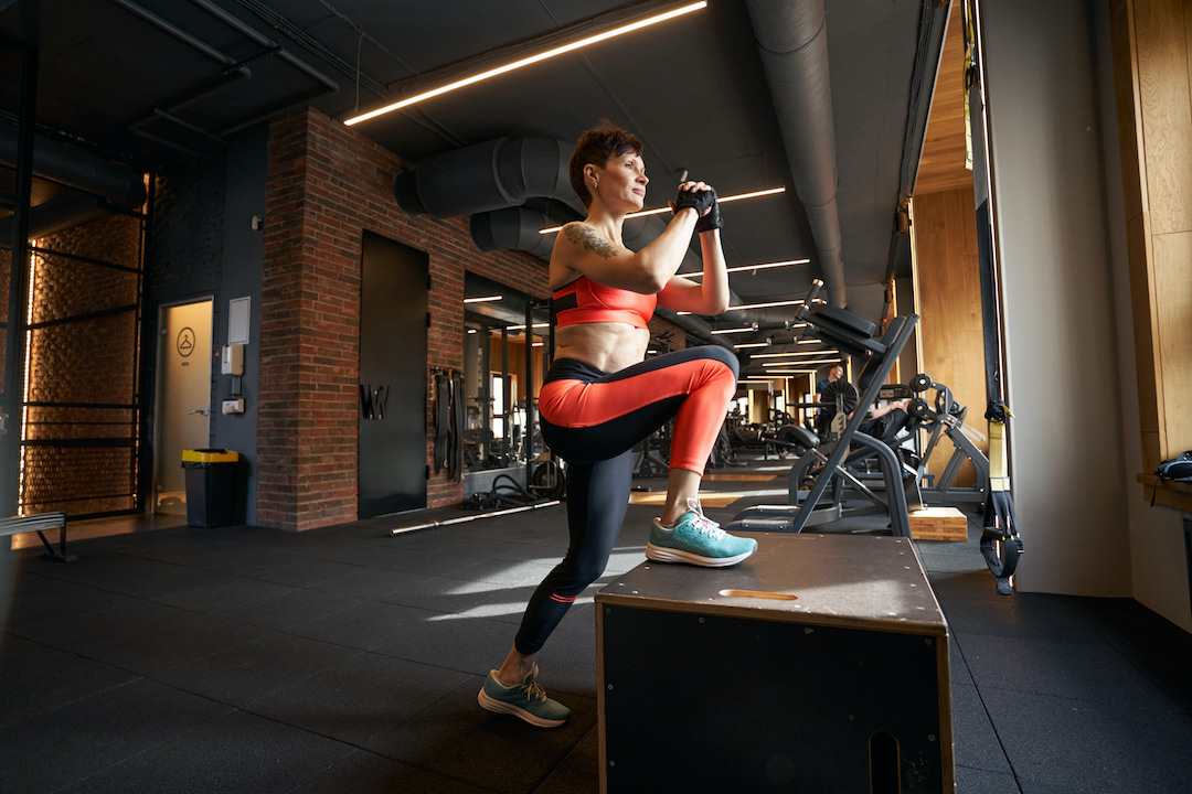 Woman using a plyo box