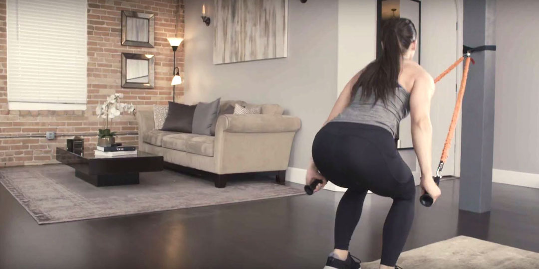 Woman working out in a home gym