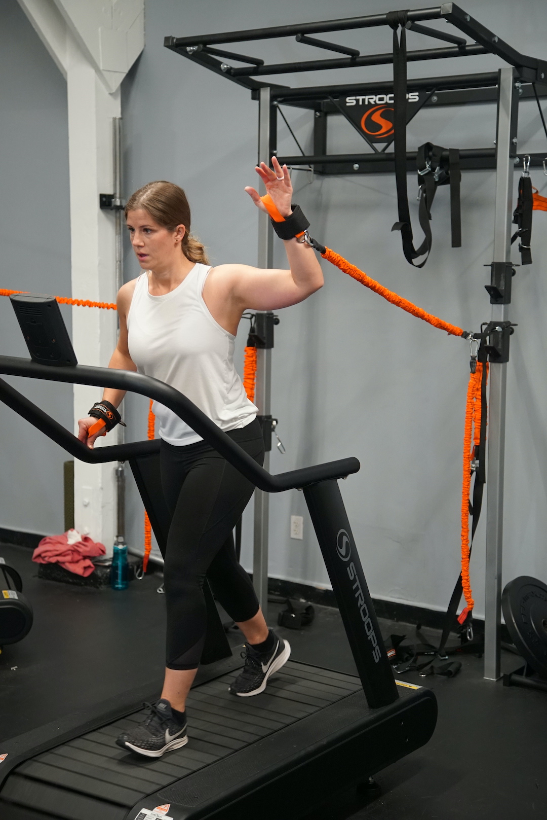 Woman using resistance bands for low-impact exercise.